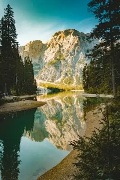 A still alpine lake mirroring the Dolomites in northern Italy