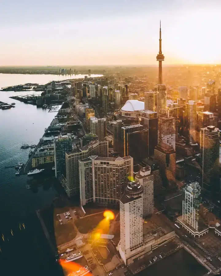 Toronto's downtown skyline and the CN Tower from the air at sunset